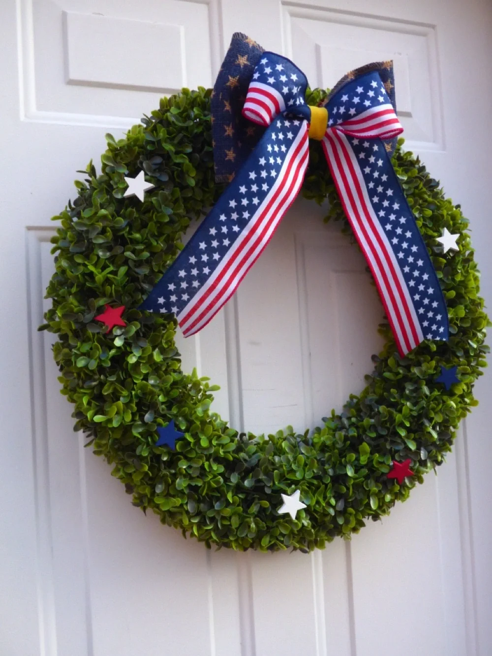 Patriotic Green Boxwood Wreath with Red White Blue Stars and Bow